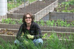 Lori Ann King weeding in the garden in upsate NY